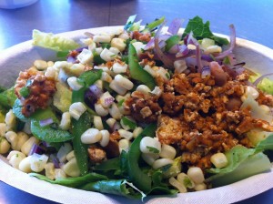Salad with sofritas filling, bell peppers, and fresh corn salsa from Santa Cruz restaurant Chipotle 